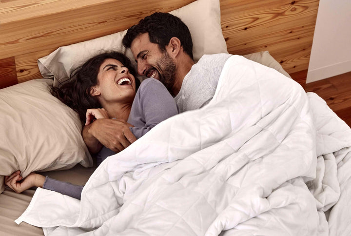 blanky being used by a couple (weighted blankets made in Portugal)